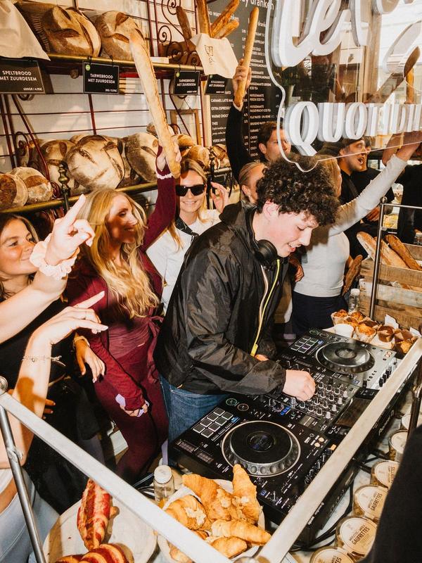 A DJ plays to a packed crowd